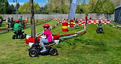 Children riding mini quads on a circuit at Parque Europa